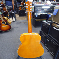 Decent entry-level acoustic guitar in good condition.